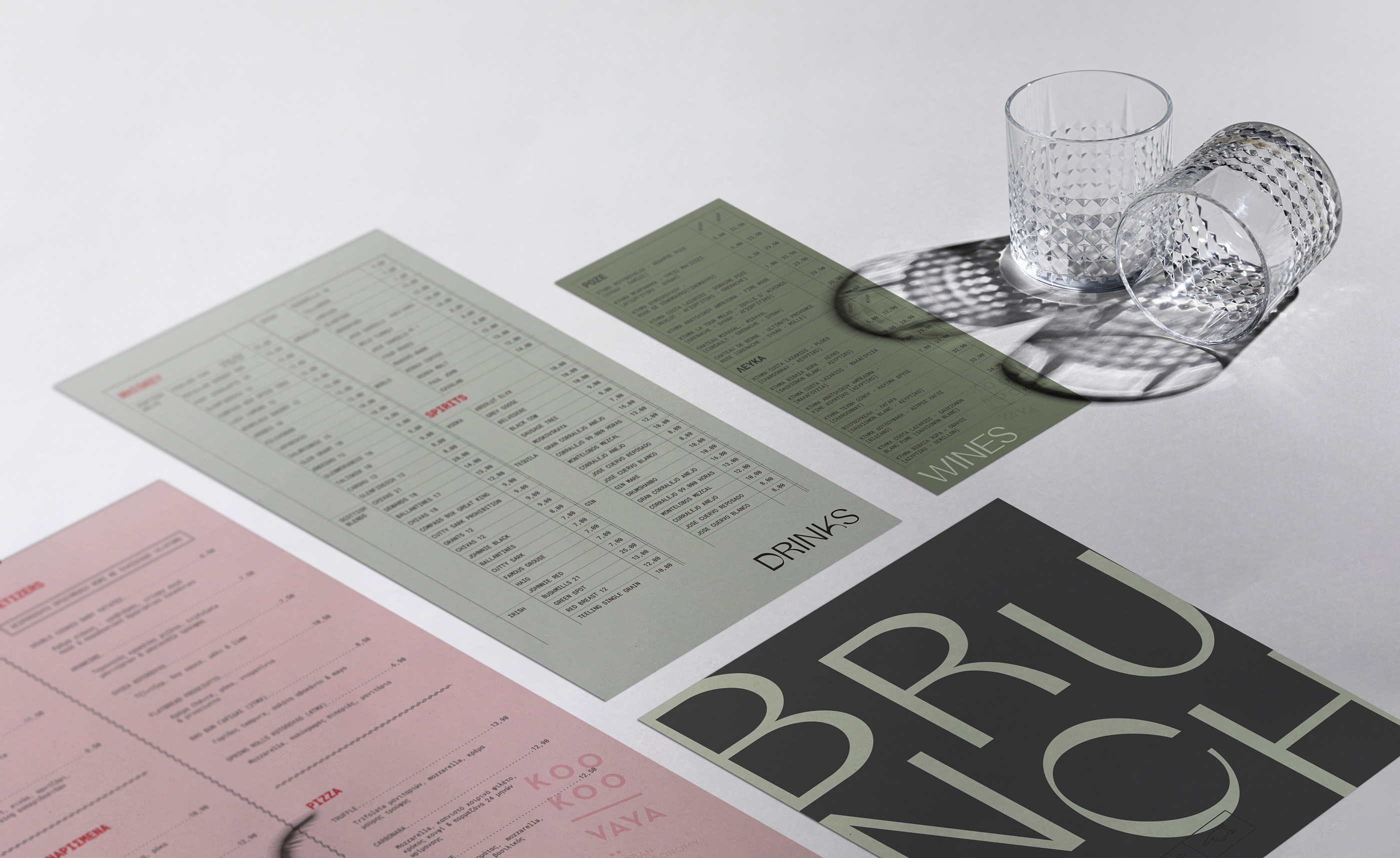 pages of menu on gray background with glass cup